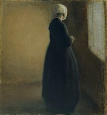 An old woman standing by a window - Вильгельм Хаммерсхёй